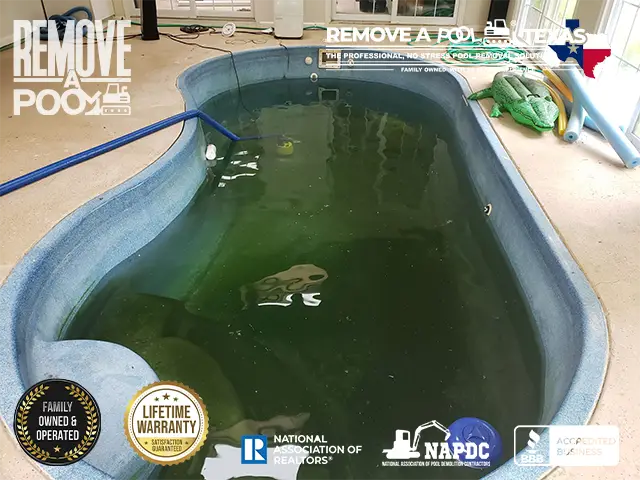 Inspecting the indoor pool to plan the removal process and ensuring all necessary safety precautions are in place.