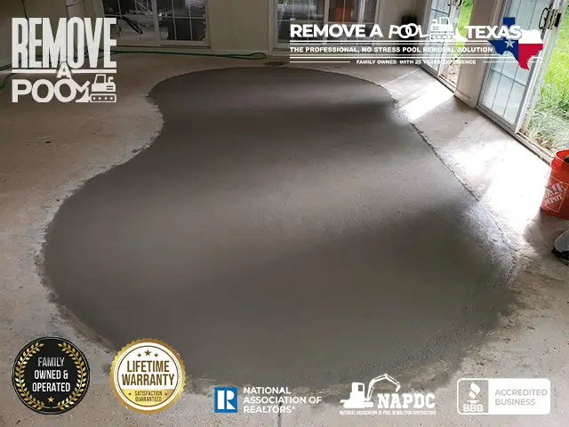 Compacting and Leveling - Compacting the gravel and leveling the surface to prepare for the final covering.